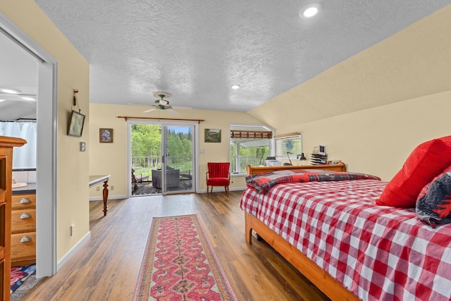 2443 Flowery Trail Rd, Usk, WA 99180 - bedroom featuring a textured ceiling, access to outside, wood finished floors, baseboards, and vaulted ceiling