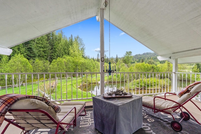 2443 Flowery Trail Rd, Usk, WA 99180 - view of patio with a wooded view and a balcony