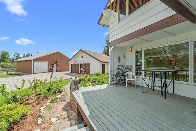 2443 Flowery Trail Rd, Usk, WA 99180 - wooden deck with a garage, an outdoor structure, and fence