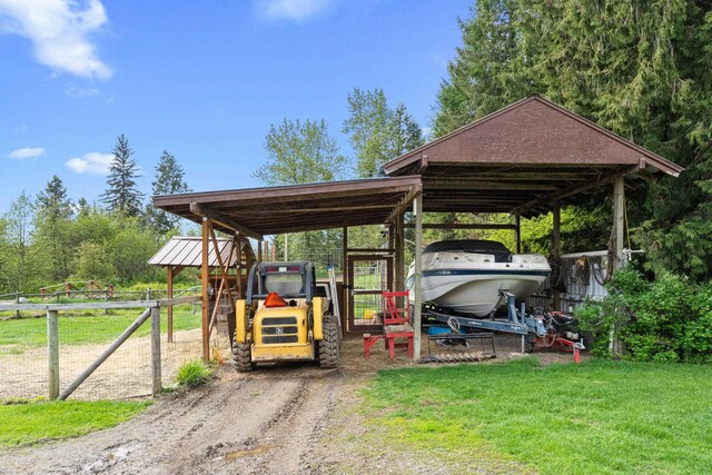 2443 Flowery Trail Rd, Usk, WA 99180 - view of parking with a carport and dirt driveway