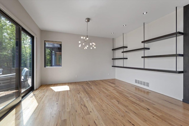 2503 S Thierman Ln, Spokane, WA 99223 - unfurnished living room featuring light wood-style flooring, a chandelier, baseboards, and recessed lighting