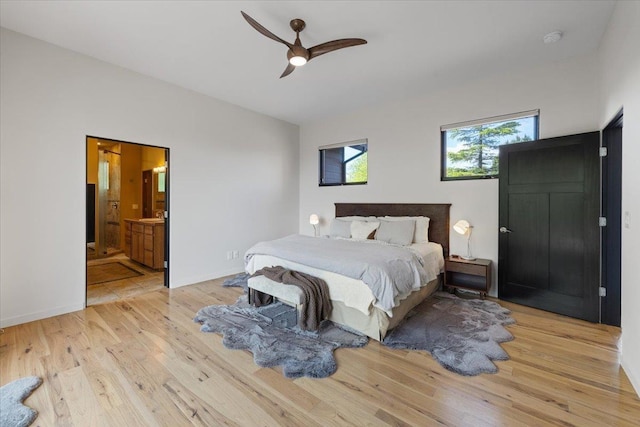 2503 S Thierman Ln, Spokane, WA 99223 - bedroom featuring light wood-type flooring, ensuite bathroom, and ceiling fan