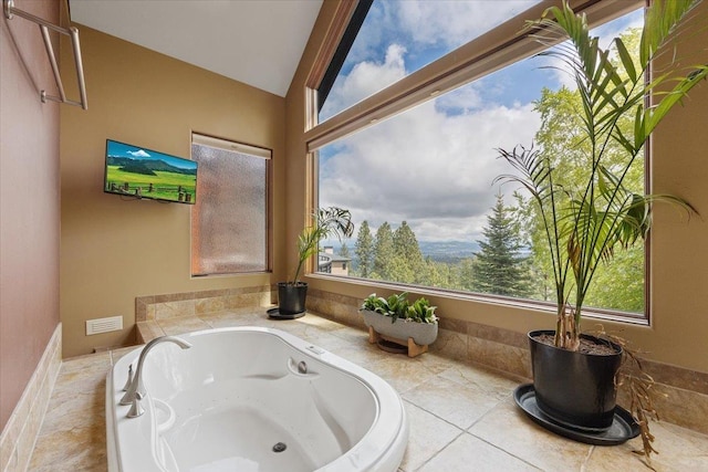 2503 S Thierman Ln, Spokane, WA 99223 - bathroom with plenty of natural light, a bath, and vaulted ceiling
