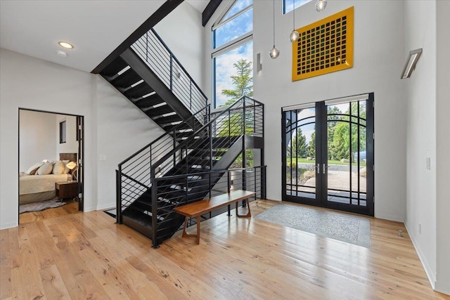 2503 S Thierman Ln, Spokane, WA 99223 - entrance foyer with a towering ceiling, hardwood / wood-style floors, stairway, french doors, and baseboards