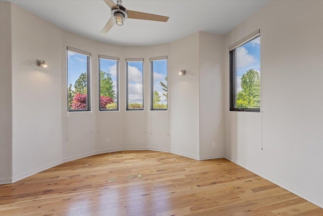 2503 S Thierman Ln, Spokane, WA 99223 - unfurnished room featuring a ceiling fan, wood finished floors, and baseboards