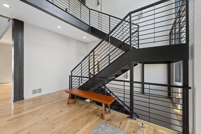 2503 S Thierman Ln, Spokane, WA 99223 - stairs featuring wood finished floors, baseboards, recessed lighting, and a towering ceiling