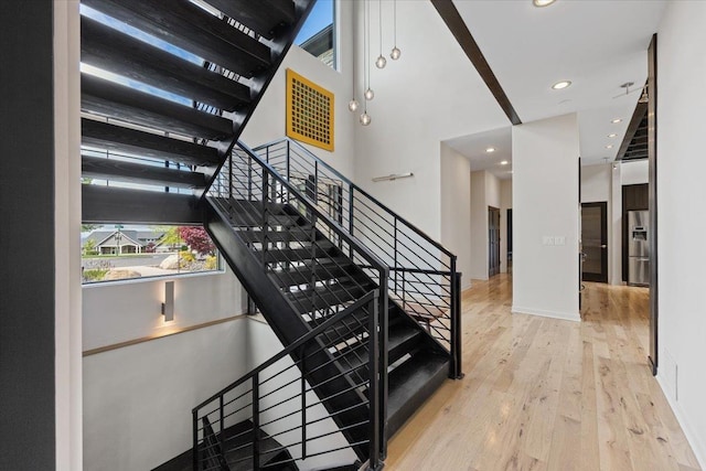 2503 S Thierman Ln, Spokane, WA 99223 - stairway with wood finished floors, recessed lighting, and baseboards
