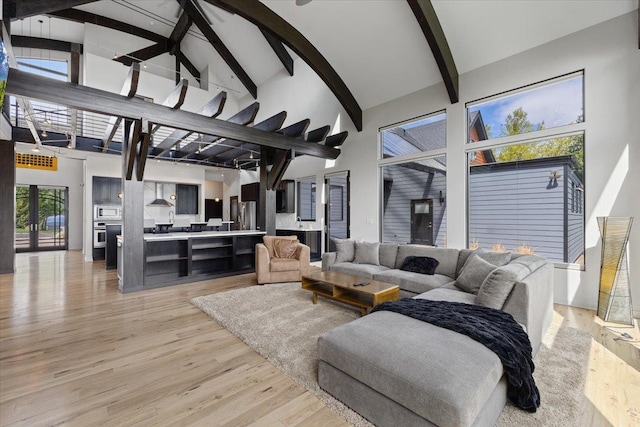 2503 S Thierman Ln, Spokane, WA 99223 - living room with high vaulted ceiling, beamed ceiling, and light wood-type flooring