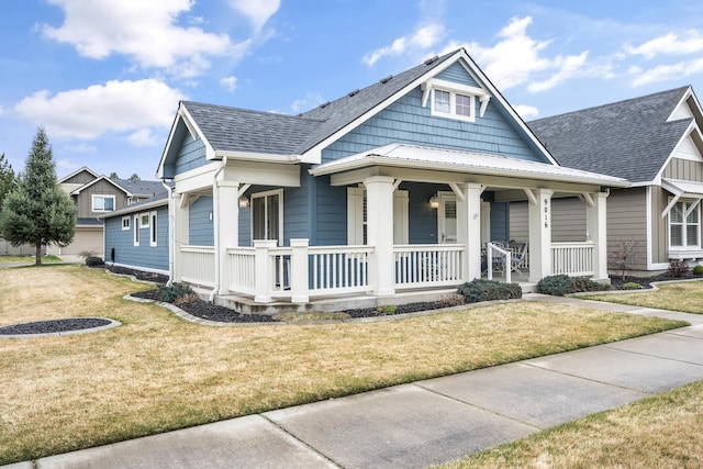 9016 N Sundance Dr, Spokane, WA 99208 - view of front facade featuring covered porch, a front yard, and roof with shingles