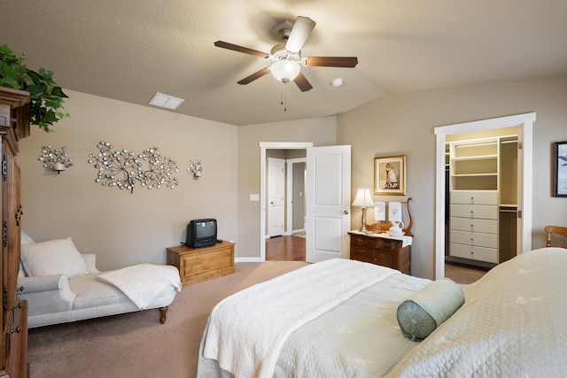 9016 N Sundance Dr, Spokane, WA 99208 - carpeted bedroom with a walk in closet, vaulted ceiling, baseboards, ceiling fan, and a closet