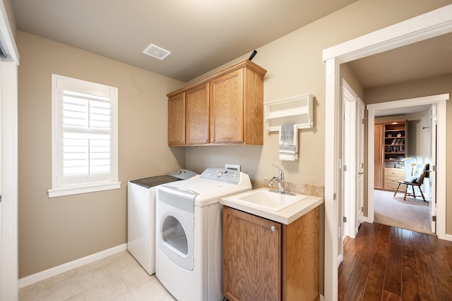 9016 N Sundance Dr, Spokane, WA 99208 - washroom with cabinet space, independent washer and dryer, baseboards, and hardwood / wood-style flooring