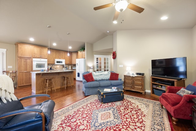 9016 N Sundance Dr, Spokane, WA 99208 - living area featuring wood finished floors, ceiling fan, recessed lighting, and lofted ceiling