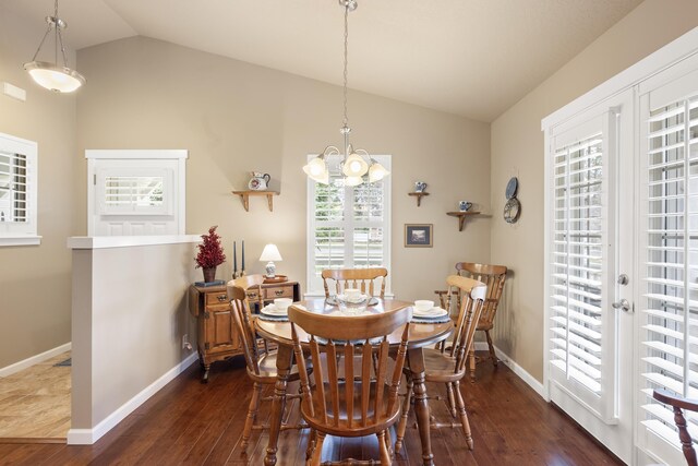 9016 N Sundance Dr, Spokane, WA 99208 - dining area with lofted ceiling, dark wood-style floors, a chandelier, and baseboards