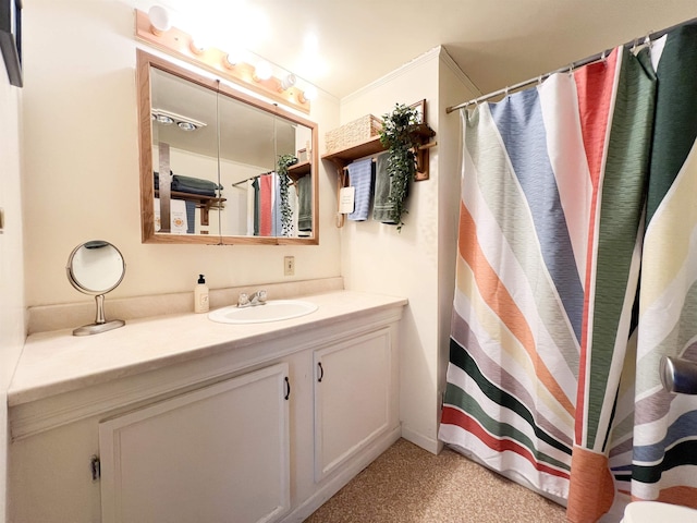 bathroom featuring vanity and curtained shower