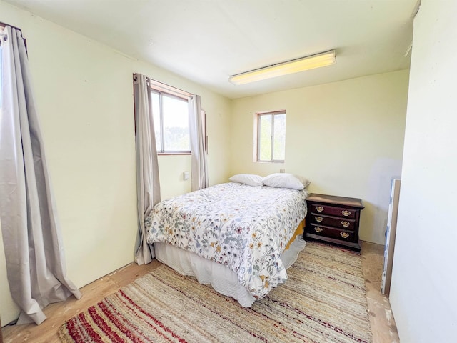 bedroom featuring light wood-style floors