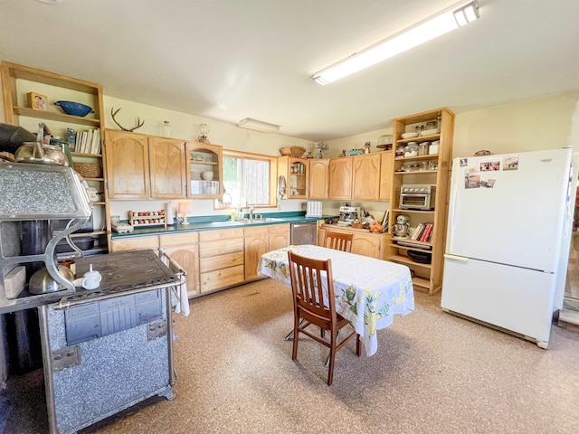kitchen with freestanding refrigerator, open shelves, light brown cabinetry, and glass insert cabinets