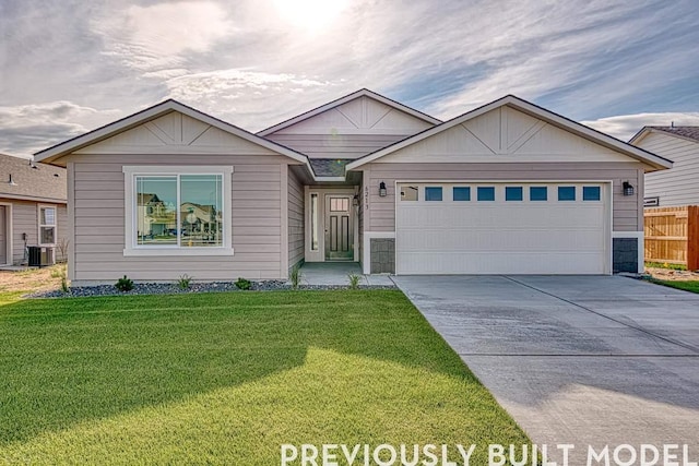 18806 E Riverside Ct, Spokane Valley, WA 99016 - ranch-style house with concrete driveway, central air condition unit, and a garage