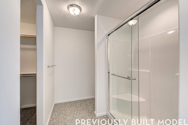 18806 E Riverside Ct, Spokane Valley, WA 99016 - full bath with baseboards, a shower stall, and a spacious closet