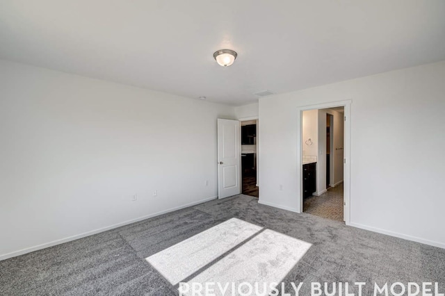 18806 E Riverside Ct, Spokane Valley, WA 99016 - unfurnished bedroom featuring carpet flooring and baseboards
