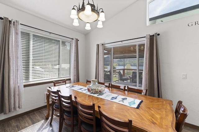 29955 N Isle View Rd, Spirit Lake, ID 83869 - dining area with a chandelier, healthy amount of natural light, dark wood-type flooring, and baseboards