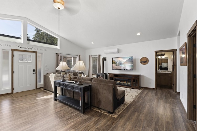 29955 N Isle View Rd, Spirit Lake, ID 83869 - living room with an AC wall unit, wood finished floors, a ceiling fan, high vaulted ceiling, and a warm lit fireplace