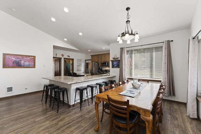 29955 N Isle View Rd, Spirit Lake, ID 83869 - dining space featuring recessed lighting, dark wood-style floors, vaulted ceiling, a chandelier, and baseboards