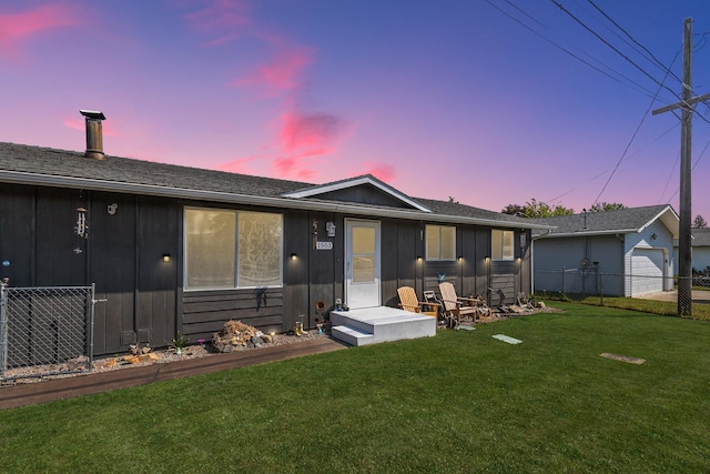 1503 E 3rd Ave, Post Falls, ID 83854 - back of house with board and batten siding and a garage