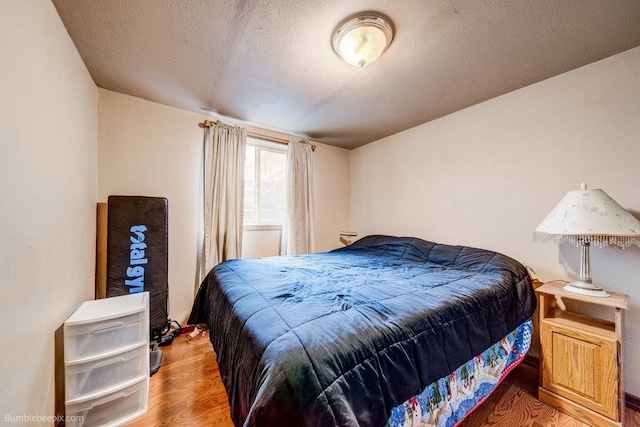 203 N Mcdonald Rd, Spokane, WA 99216 - bedroom with wood finished floors and a textured ceiling