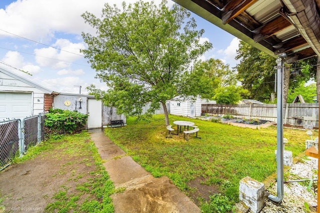 203 N Mcdonald Rd, Spokane, WA 99216 - view of yard with a storage unit, an outbuilding, and a garden