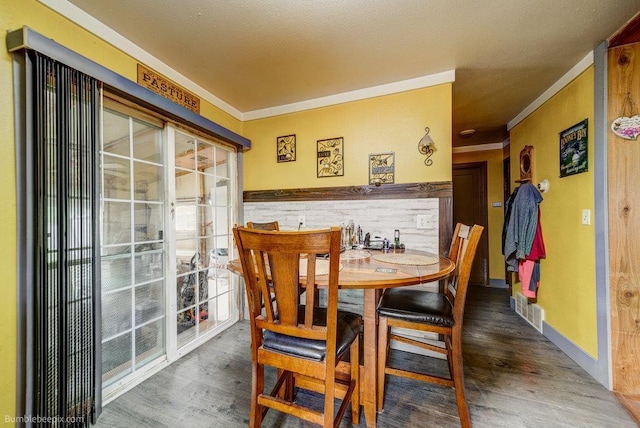 203 N Mcdonald Rd, Spokane, WA 99216 - dining area with crown molding and wood finished floors