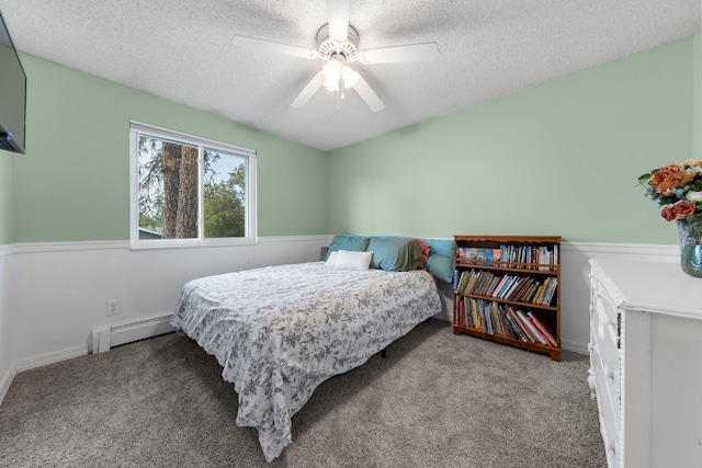 11010 E 28th Ave, Spokane, WA 99206 - bedroom with a baseboard heating unit, carpet, a textured ceiling, a ceiling fan, and baseboards
