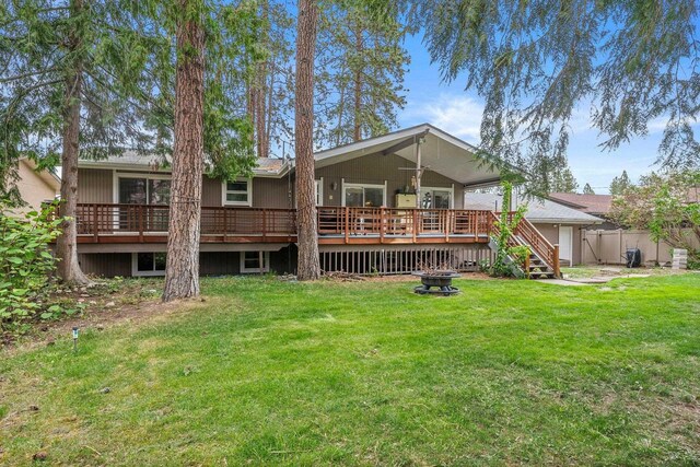 11010 E 28th Ave, Spokane, WA 99206 - back of house with an outdoor fire pit, a deck, and a garage