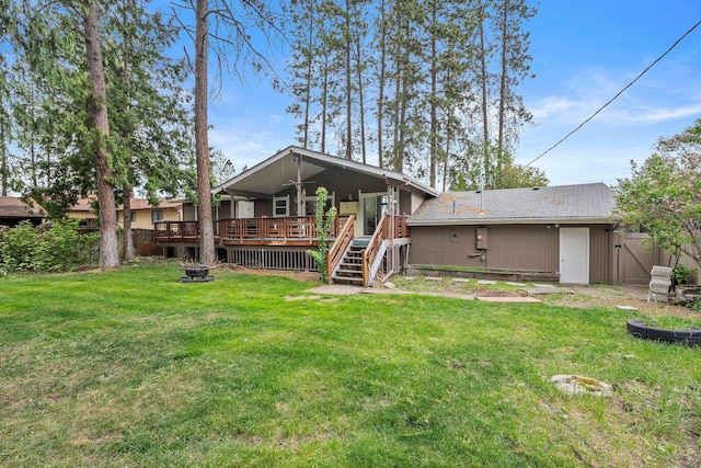 11010 E 28th Ave, Spokane, WA 99206 - rear view of property featuring an outdoor fire pit, a deck, and stairs