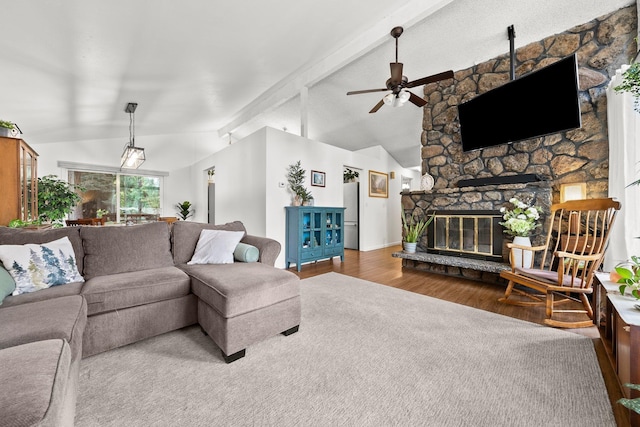 11010 E 28th Ave, Spokane, WA 99206 - living room featuring wood finished floors, ceiling fan, a fireplace, and baseboards