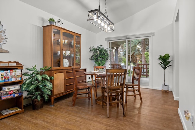 11010 E 28th Ave, Spokane, WA 99206 - dining area featuring wood finished floors, baseboards, and high vaulted ceiling