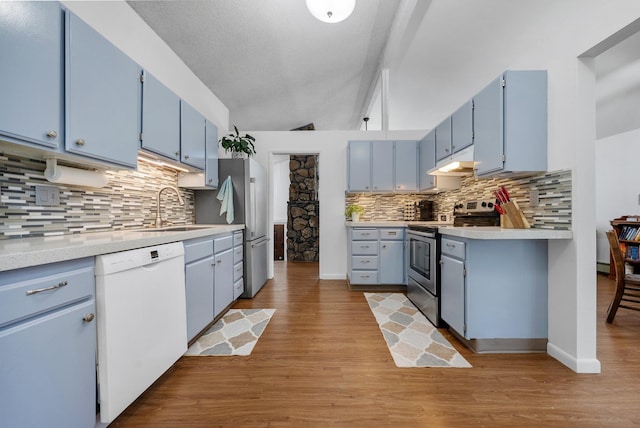 11010 E 28th Ave, Spokane, WA 99206 - kitchen featuring white dishwasher, stainless steel range with electric cooktop, blue cabinets, and a sink