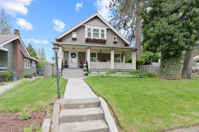 bungalow-style house featuring covered porch and cooling unit
