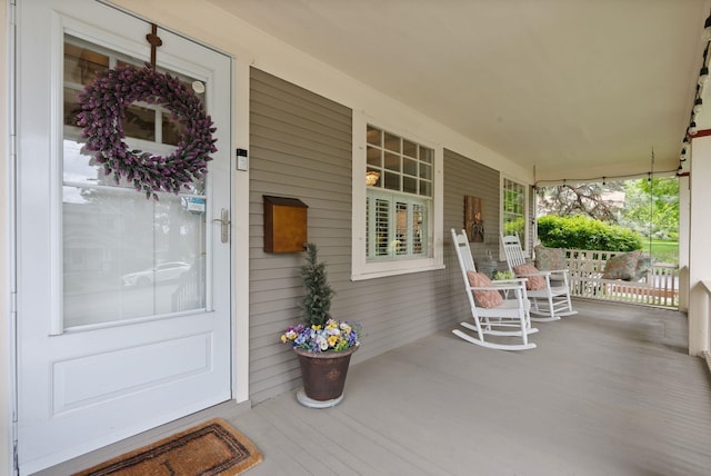 doorway to property featuring a porch
