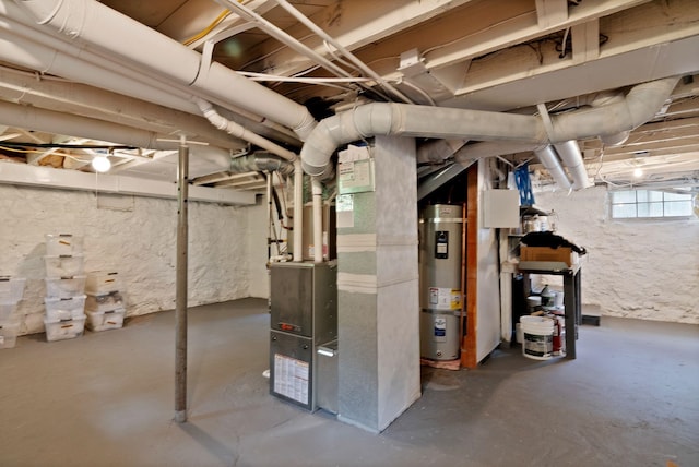 basement featuring water heater and heating unit