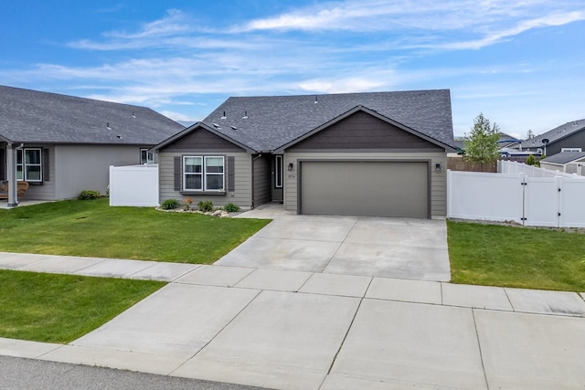 18924 E Fredrick Ave, Otis Orchards, WA 99027 - view of front of property featuring a garage, driveway, a gate, and a shingled roof