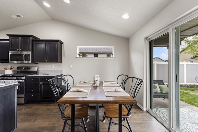 18924 E Fredrick Ave, Otis Orchards, WA 99027 - dining area with vaulted ceiling, dark wood-style floors, and recessed lighting