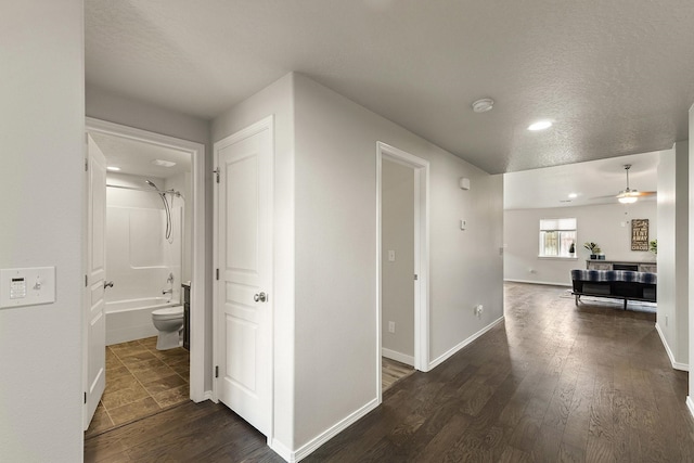 18924 E Fredrick Ave, Otis Orchards, WA 99027 - hall with dark wood-style floors, a textured ceiling, recessed lighting, and baseboards