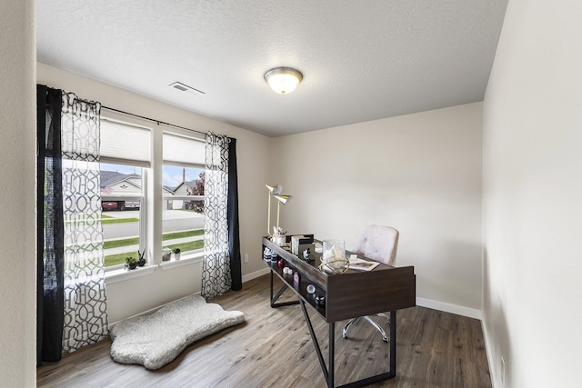 18924 E Fredrick Ave, Otis Orchards, WA 99027 - office space with wood finished floors, baseboards, and a textured ceiling