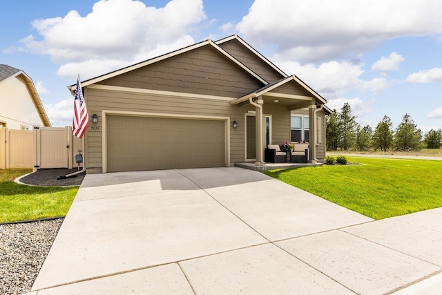 7919 W 55th Ave, Spokane, WA 99224 - view of front of home featuring an attached garage and driveway