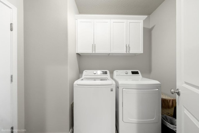 7919 W 55th Ave, Spokane, WA 99224 - washroom featuring independent washer and dryer and cabinet space