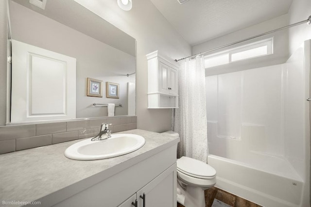 7919 W 55th Ave, Spokane, WA 99224 - bathroom featuring toilet, backsplash, vanity, shower / bath combination with curtain, and wood finished floors