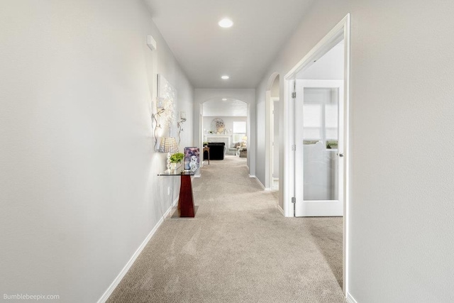 7919 W 55th Ave, Spokane, WA 99224 - hall featuring arched walkways, carpet flooring, recessed lighting, and baseboards
