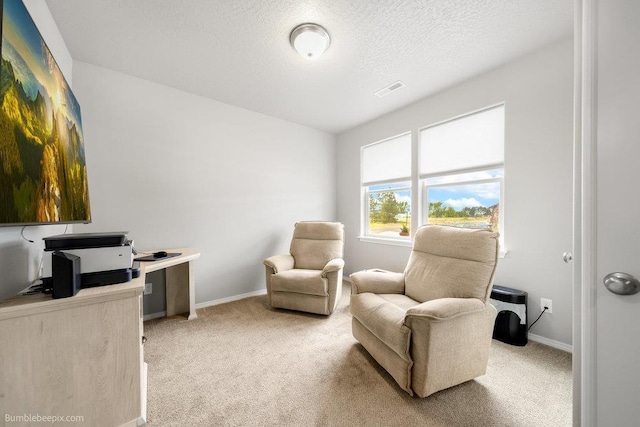 7919 W 55th Ave, Spokane, WA 99224 - sitting room with light carpet, baseboards, a textured ceiling, and an office area