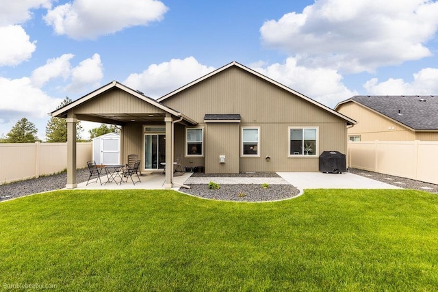 7919 W 55th Ave, Spokane, WA 99224 - back of house with a storage shed, a patio area, and an outdoor structure