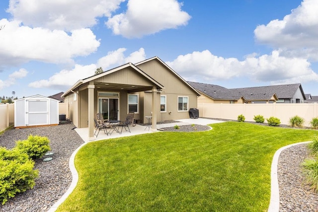 7919 W 55th Ave, Spokane, WA 99224 - rear view of house with a storage unit, a patio, and an outbuilding